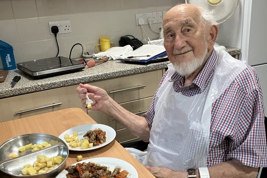 IPU patient Peter Moffat making himself steak