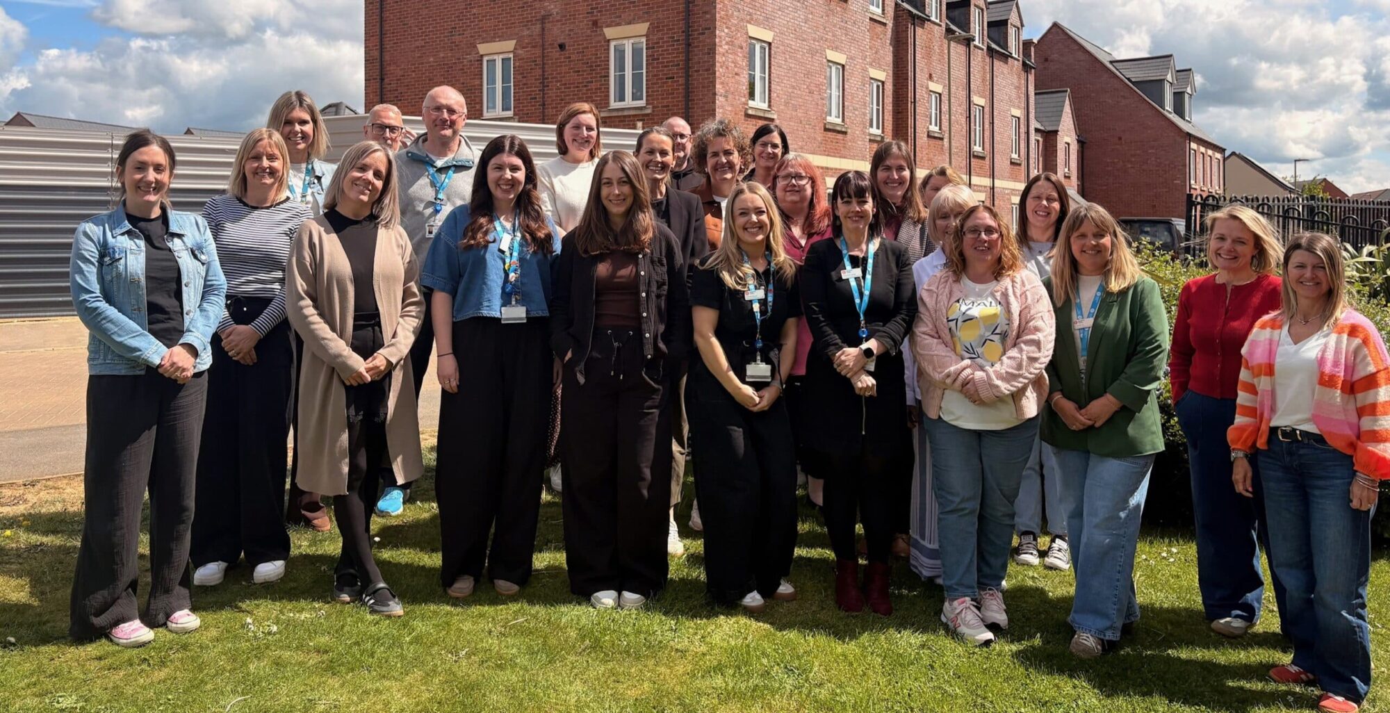 Staff Away Day Longford Park May 2026 Katharine House team staff smiling in the sunshine